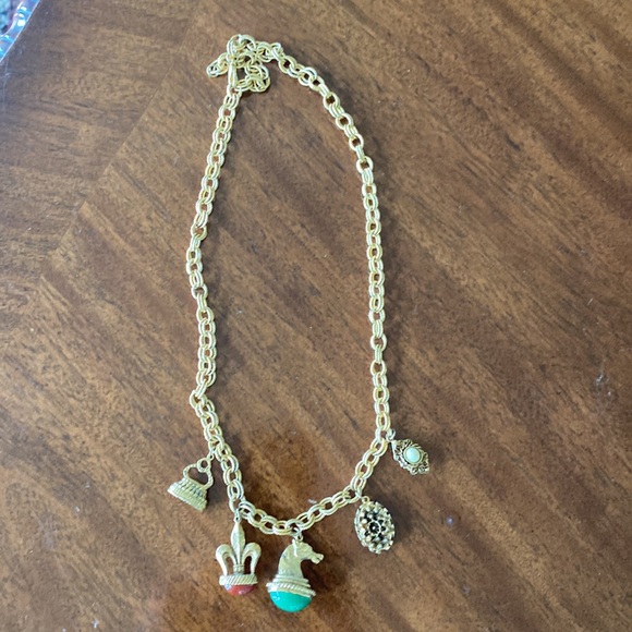 Gold tone charm necklace. Adjustable length. Great condition. - Picture 9 of 10
